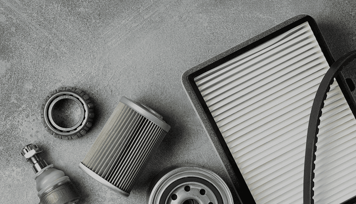 Cabin air filter and automotive parts on a stone work surface