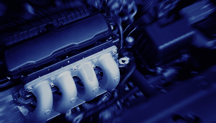 Blue-tinted close-up of a modern car engine block