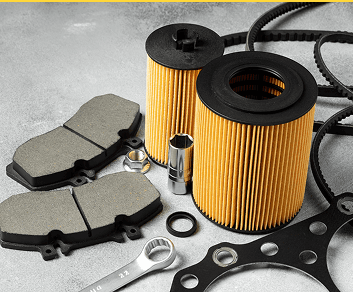 New oil filters and automotive parts on a work surface