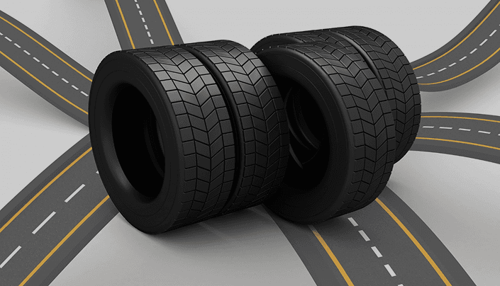 Three new tires standing at a road intersection illustration