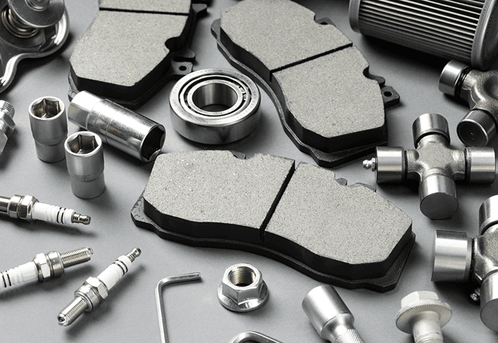 New brake pads and automotive parts arranged on a work surface
