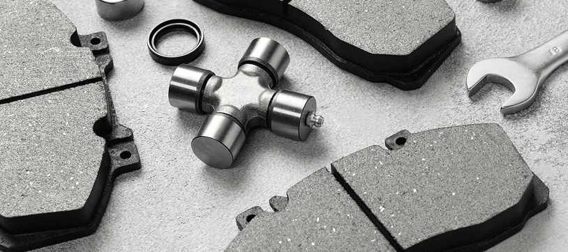 Brake pads and automotive parts arranged on a work surface