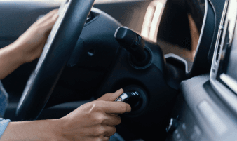 Technician performing a power steering flush service