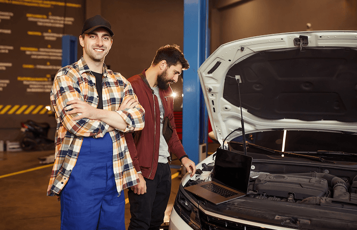 Ten Minute Oil Change technicians providing expert transmission fluid service