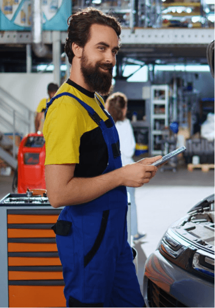 Technician reviewing vehicle service details on a tablet