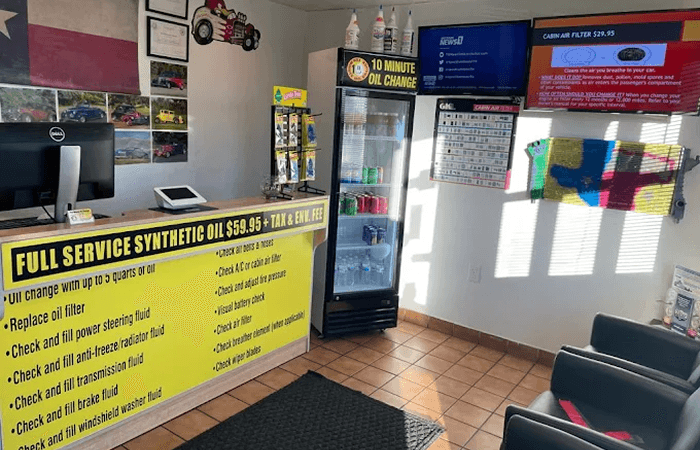 Ten Minute Oil Change reception counter and waiting area in Garland