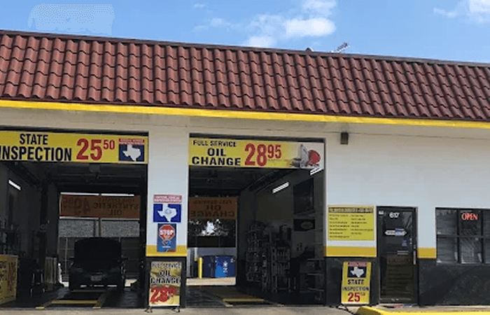 Ten Minute Oil Change Garland shop exterior with open service bays