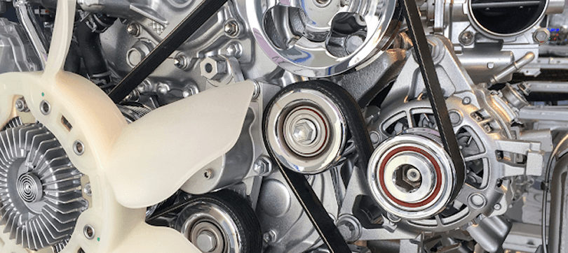 Close-up of a car engine bay during state vehicle inspection service