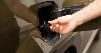 Technician replacing a vehicle gas cap