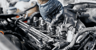 Close-up of engine components during spark plug service
