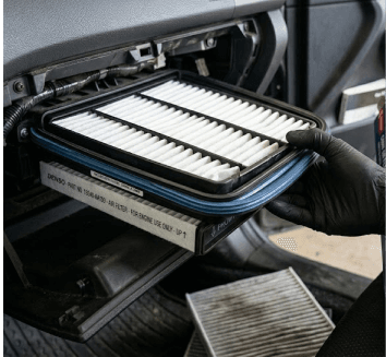 Close-up of a new cabin air filter being installed