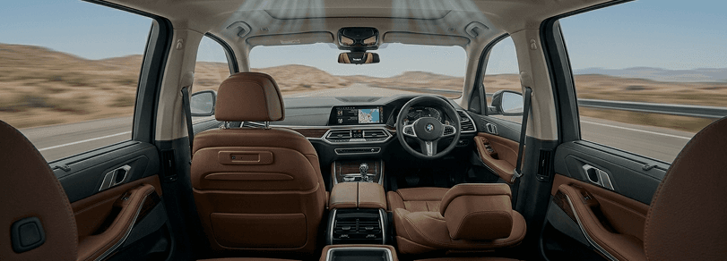 Car interior with cool air flowing from AC vents