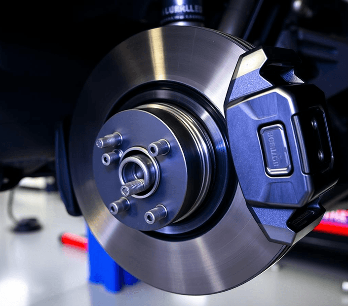 Close-up of a car brake rotor and caliper